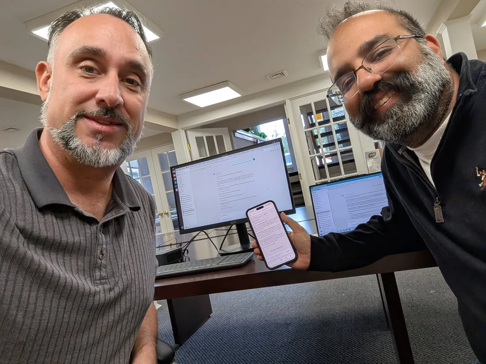 Glenn Murano delivering an AI agent in person to a Connecticut business owner