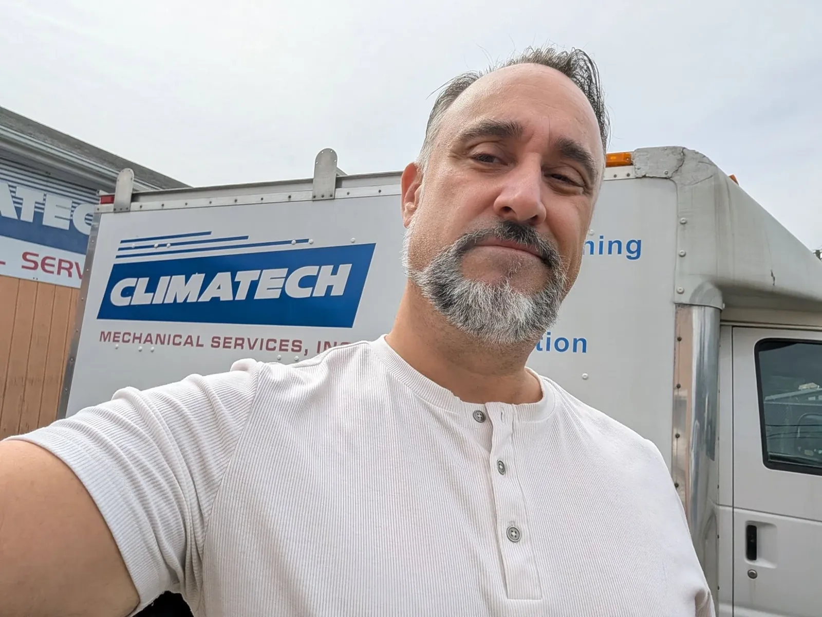 Glenn Murano in front of a Climatech Mechanical Services truck