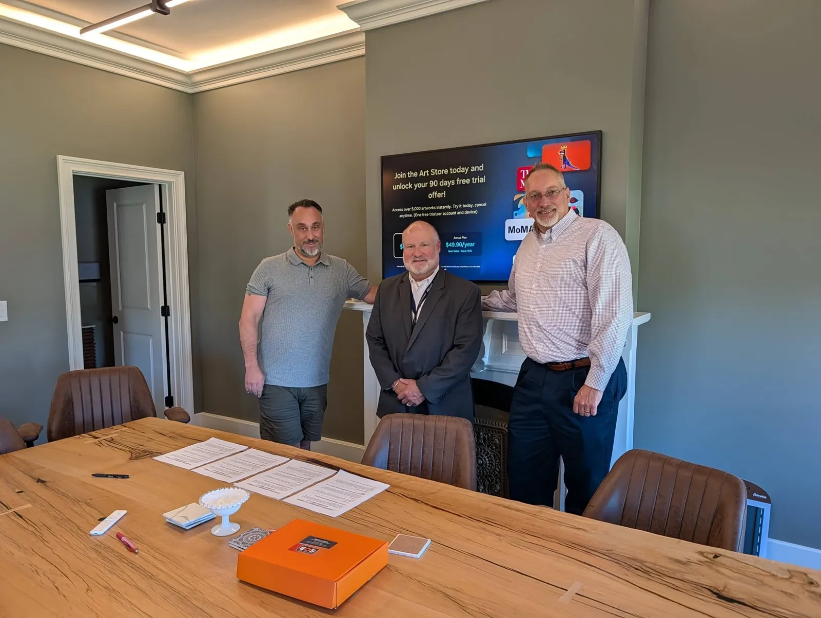 Glenn Murano with two Connecticut business owners after signing an agreement